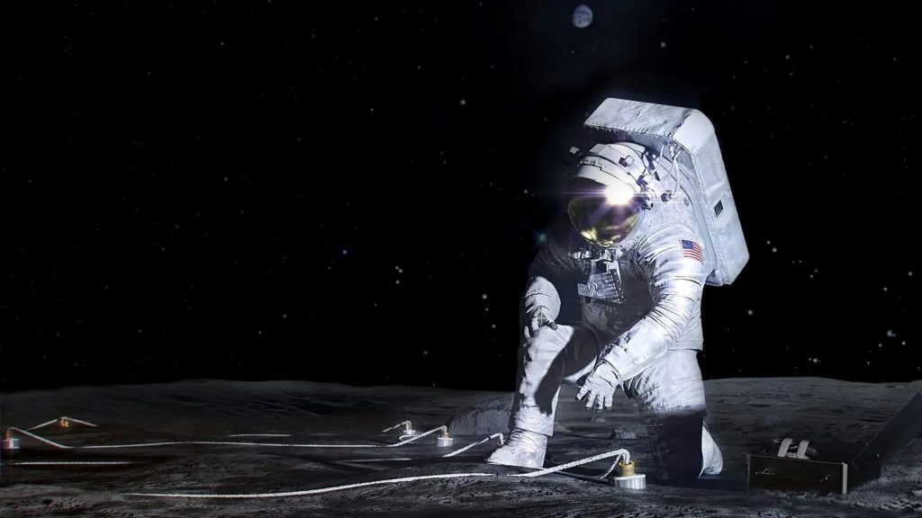 Astronaut in a spacesuit conducting scientific work on the Moon’s surface with equipment and cables under a dark starry sky. History of Space Exploration